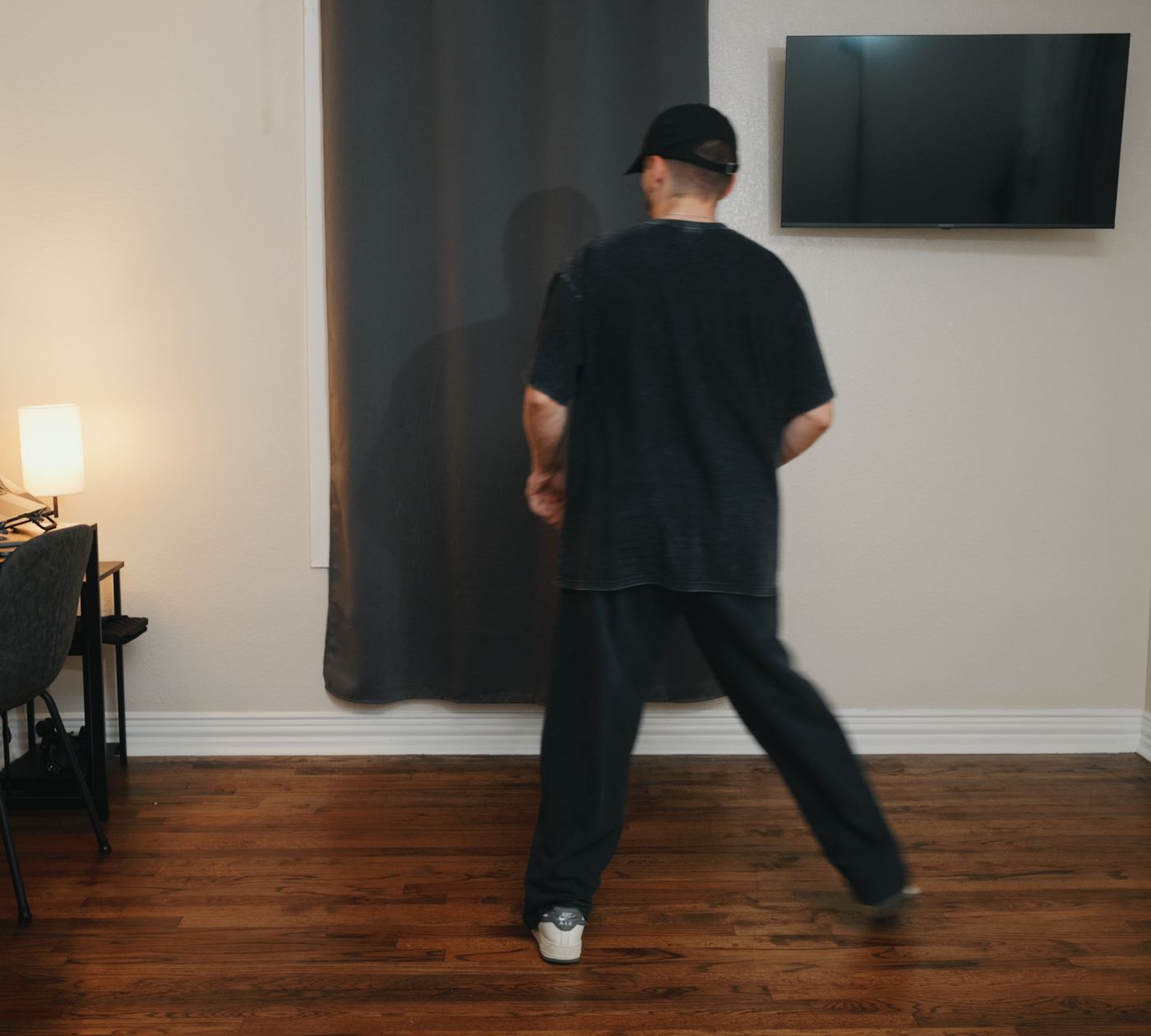Patrick from behind, mid-step, so you can follow his feet